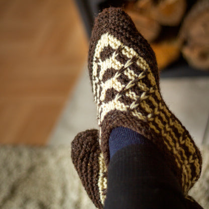 Knitted wool slippers in brown and white natural colors 