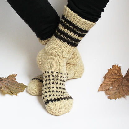 white ivory wool socks with black dots on white background